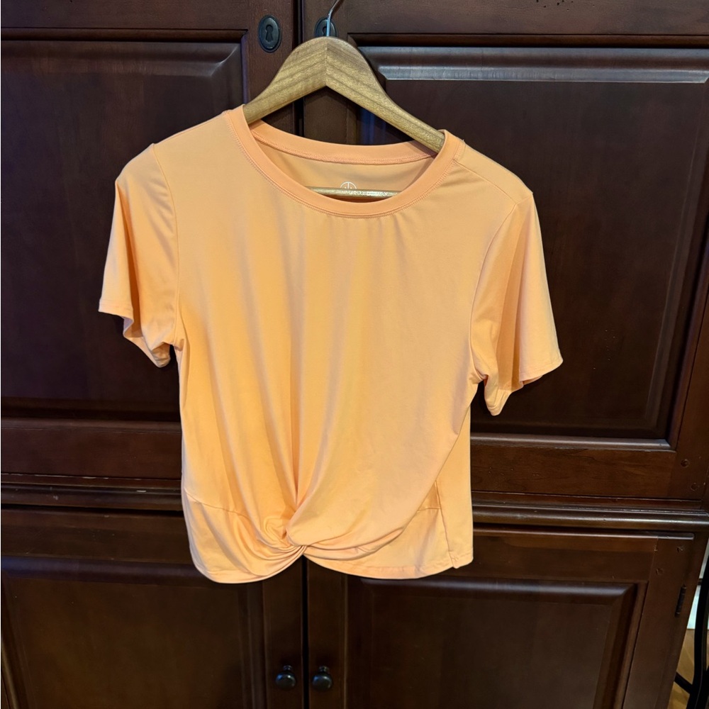 Bright melon twist front yoga top, size Large.